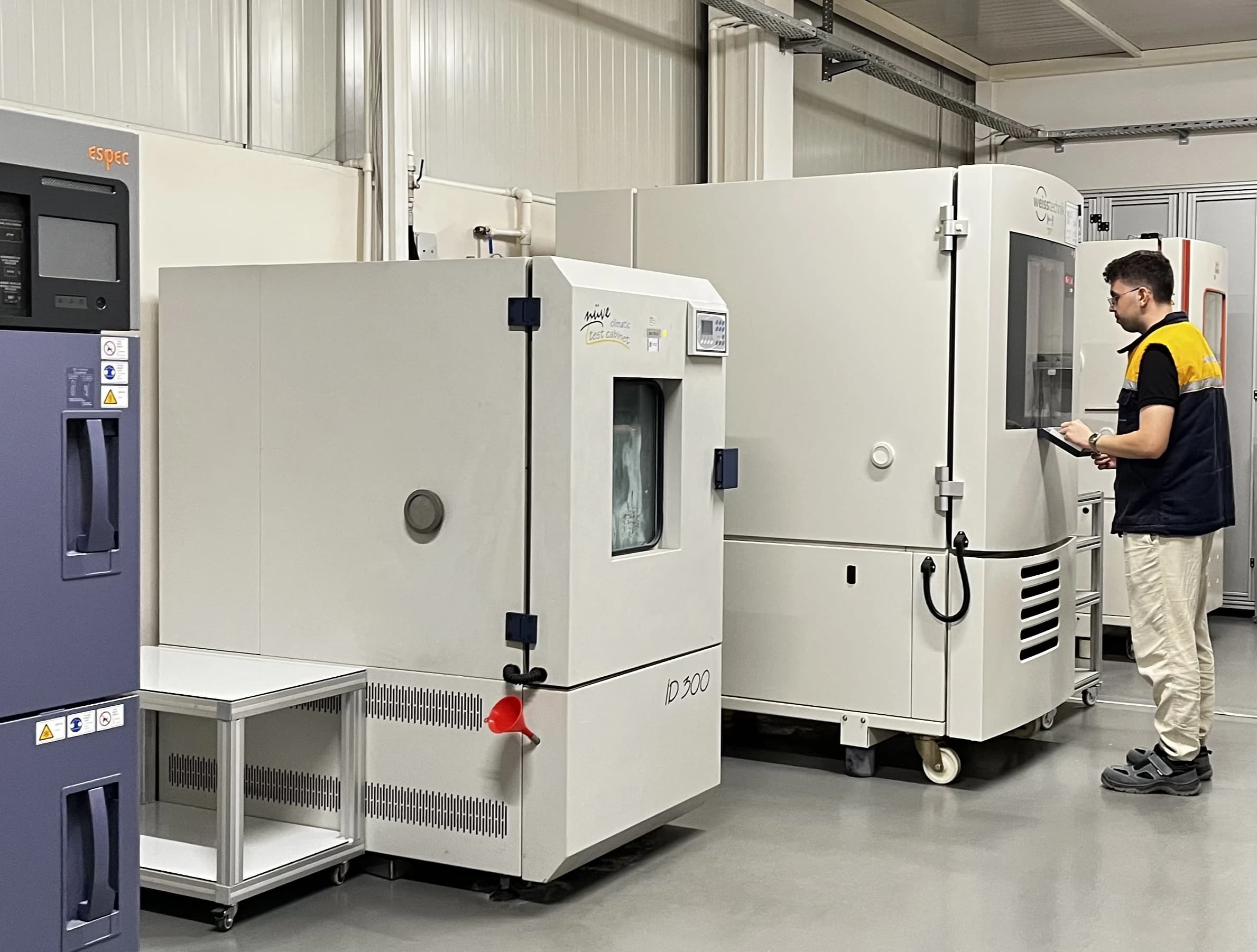 Row of environmental test chambers including an ESPEC thermal-shock chamber in the Makersan laboratory