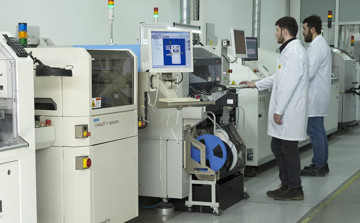 Makersan technicians operating the SMT electronics assembly line