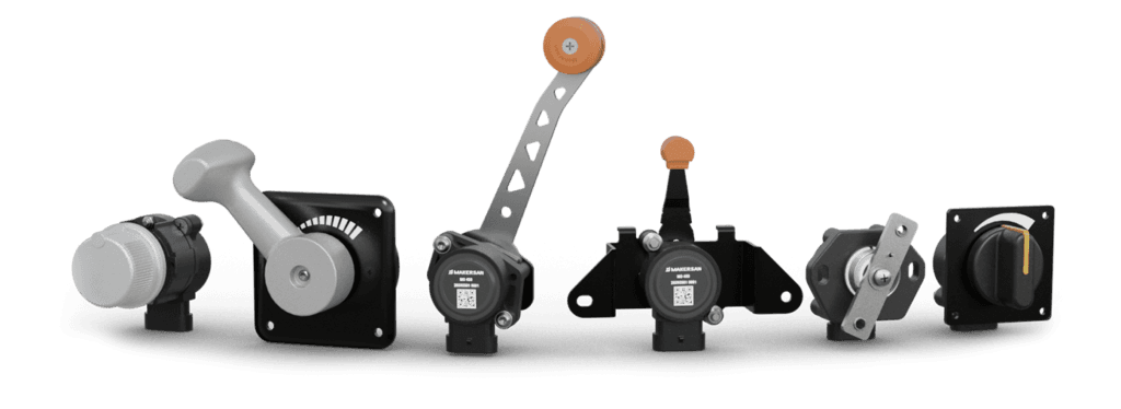 Makersan electronic control lever family: rotary knobs, hand-throttle heads and control levers with orange grips.
